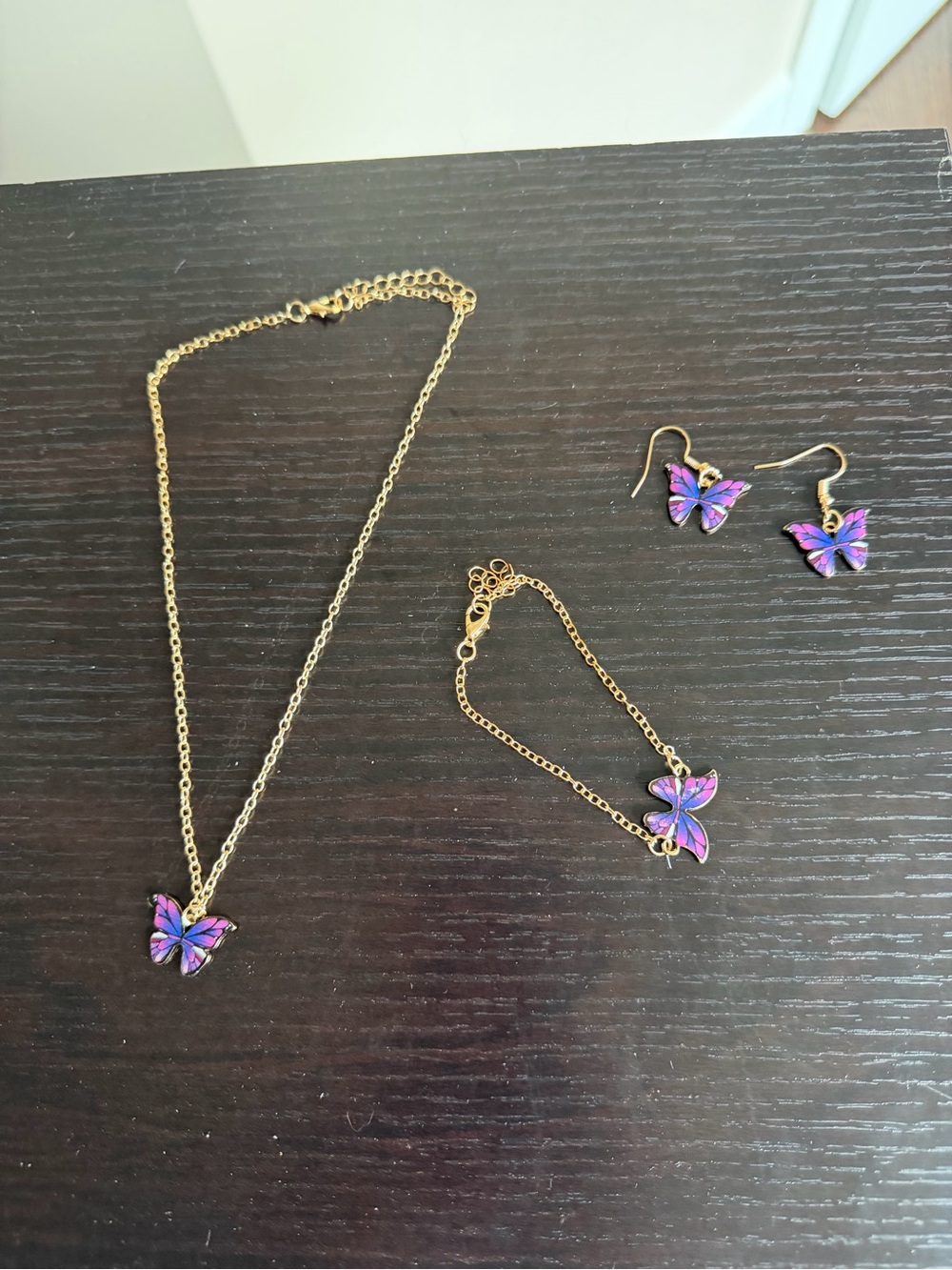 Gold-tone Butterfly Jewelry Set including Necklace, Bracelet, and Earrings